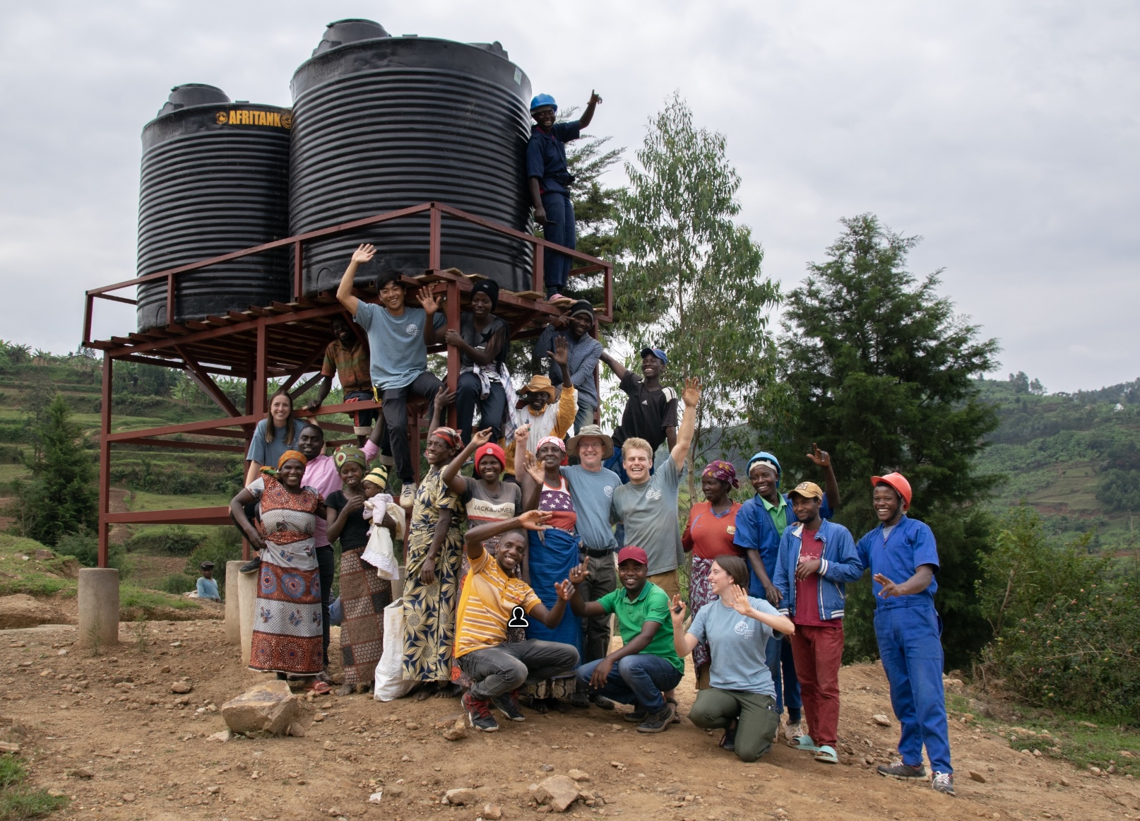 EWB with community celebrating successful water project